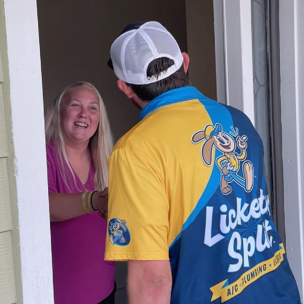 A Lickety Split technician greeting a Jacksonville homeowner at the door